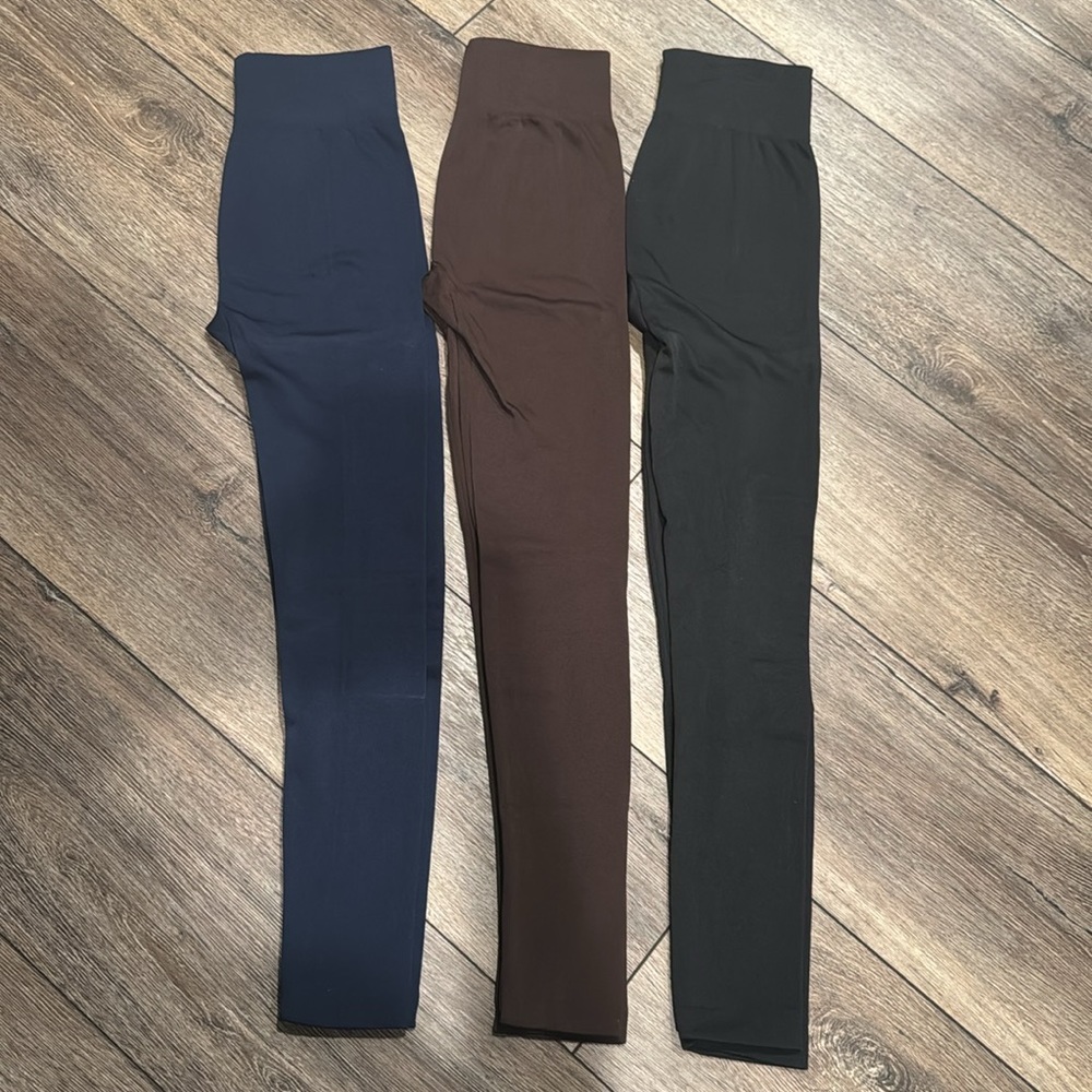 Three pairs of fleece lined leggings.